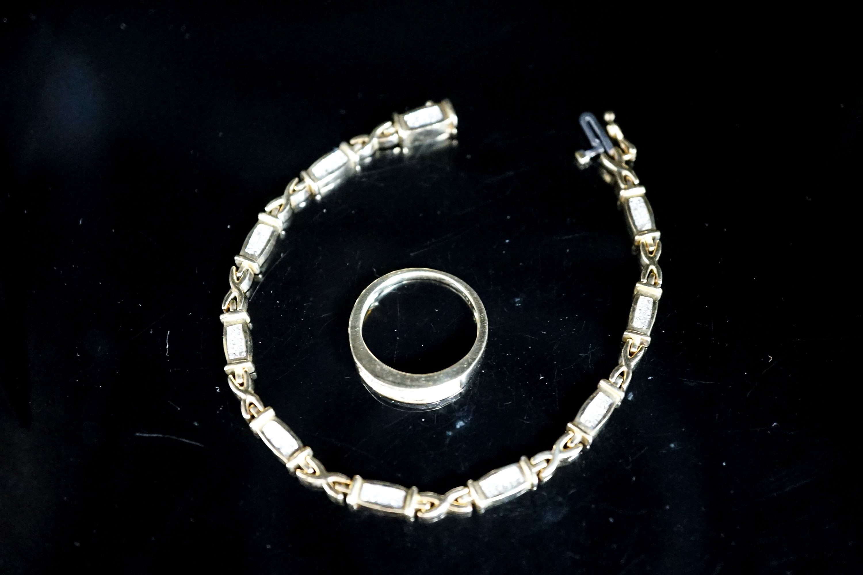 A modern 14k yellow metal and diamond chip set line bracelet, 18cm and a matching ring, size O/P, gross weight 17.2 grams.